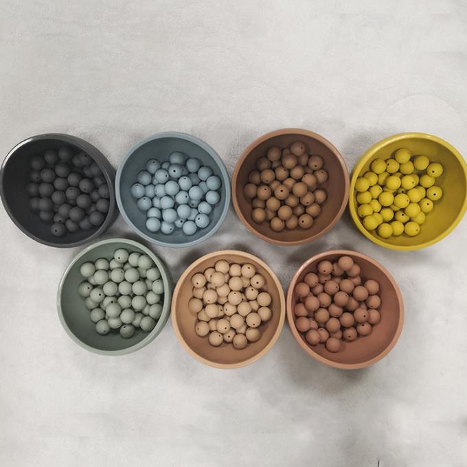 Nouvelles perles en gros de silicone de couleur autour des perles formées de faire ses dents pour le bébé