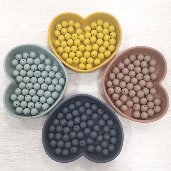 Nouvelles perles en gros de silicone de couleur autour des perles formées de faire ses dents pour le bébé
