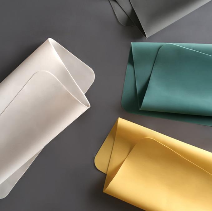 Tapis résistant à la chaleur en gros de vaisselle de cuisine de silicone de catégorie comestible pour le dîner