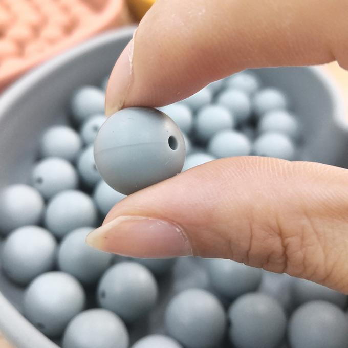 La dentition perle le nouveau doux de couleur autour du silicone formé pour le silicone de catégorie comestible du bébé 100%