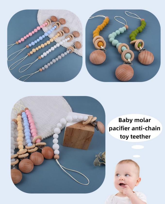 Prévention factice de chaîne de tétine de bébé de bébé de perle en bois qui respecte l'environnement en gros de silicone avec l'anneau en bois